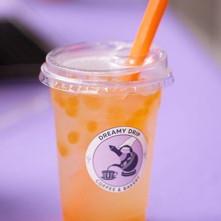 A mango boba drink in a Dreamy Drip cup