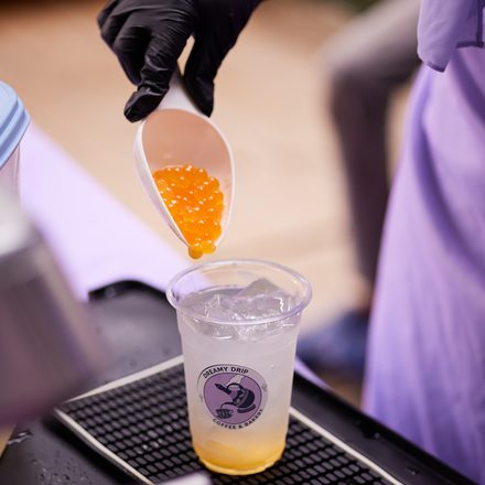 Adding boba pearls to a freshly made Dreamy Drip drink