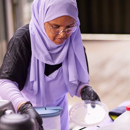 Amaturahaman preparing fresh drinks at the Dreamy Drip stand